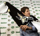 Evgeni Malkin Fansite.com Evgeni Malkin trying on his new Penguins jersey after signing contract (Keith Srakocic / AP)